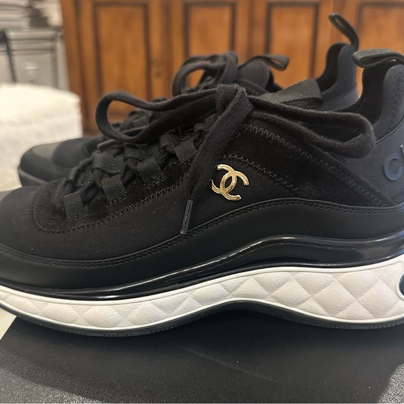 CHANEL Shoes - CHANEL Black & White Quilted Sneakers with Gold CC Charm size 37.5